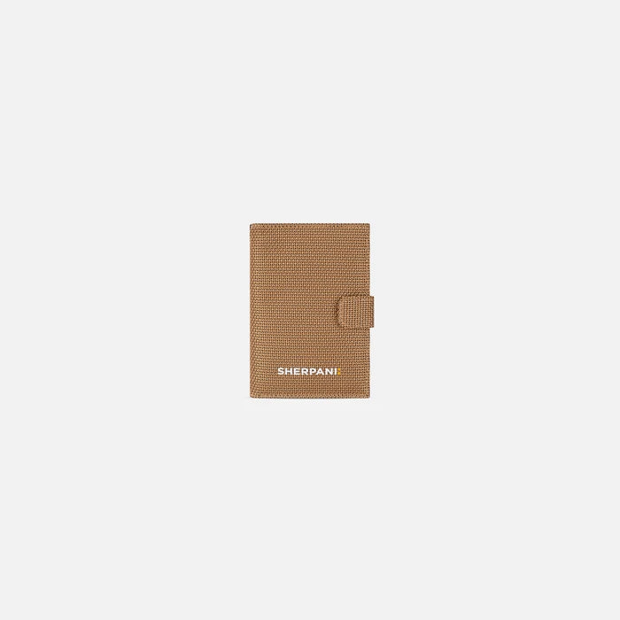 A Sherpani Vienna Sand Anti-theft Passport Wallet, front view against white background. #color_sand-tan