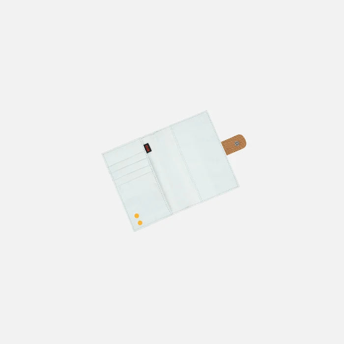 A Sherpani Vienna Sand Anti-theft Passport Wallet, above view showing inside of wallet against white background.  #color_sand-tan