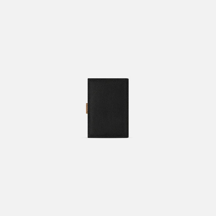 A Sherpani Vienna Sand Anti-theft Passport Wallet, back view against white background. #color_sand-tan