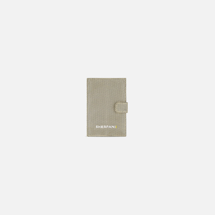 A Sherpani Vienna Straw Beige Anti-theft Passport Wallet, front view against white background. #color_straw-beige