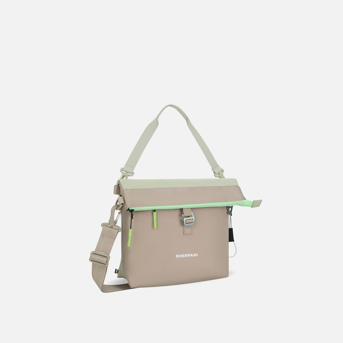 A Sherpani Viso Desert Aloe Foldover Bag, 3/4 view showing folded over front and strap options on white backdrop.  #color_desert-aloe