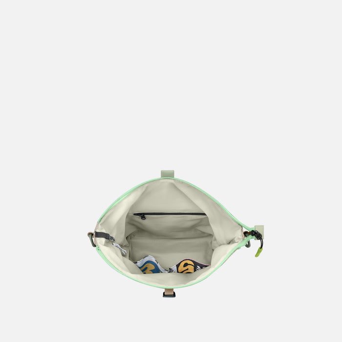 A Sherpani Viso Desert Aloe Foldover Bag, above view showing inside main pocket on white backdrop.  #color_desert-aloe