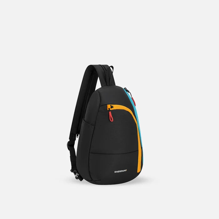 A Sherpani Wayfarer Chromatic Black Convertible Sling, 3/4 view showing lockable pockets and main strap on white background. #color_chromatic-black