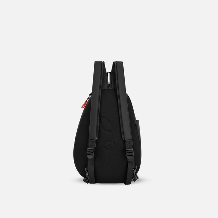 A Sherpani Wayfarer Chromatic Black Convertible Sling, back view showing convertible strap against a white background.  #color_chromatic-black