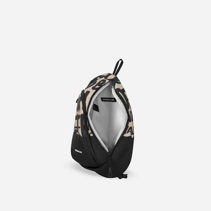 A Sherpani Wayfarer Ciao Convertible Sling, above view showing inside of main pocket against white background.  #color_ciao-print