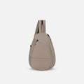 A Sherpani Wayfarer Dune Convertible Sling, front view showing lockable pockets and main strap on white background. #color_dune-tan
