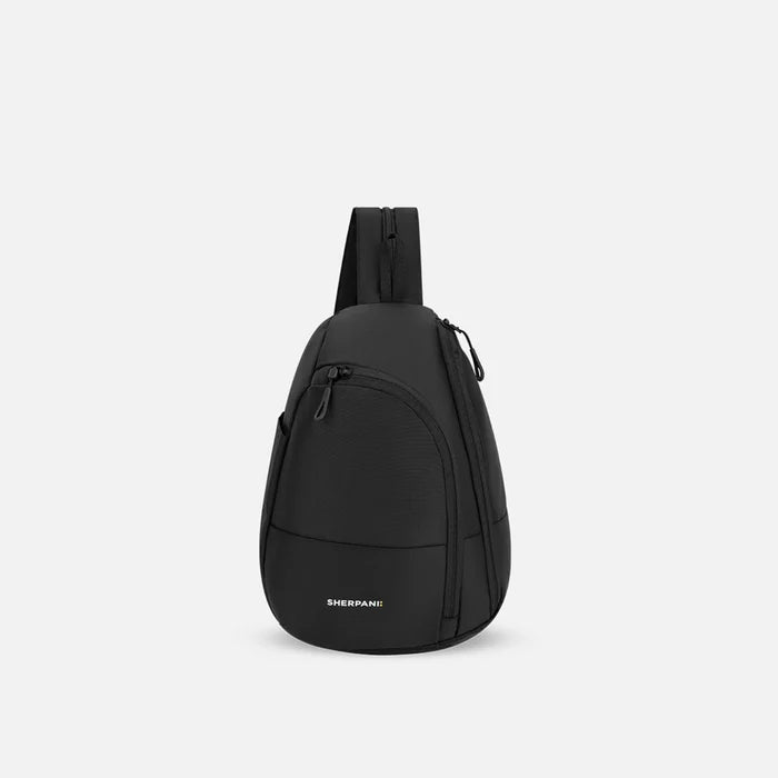A Sherpani Wayfarer Raven Black Convertible Sling, front view showing lockable pockets and main strap on white background. #color_raven-black
