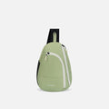 A Sherpani Wayfarer Palm Green Convertible Sling, front view showing lockable pockets and main strap on white background. #color_palm-green
