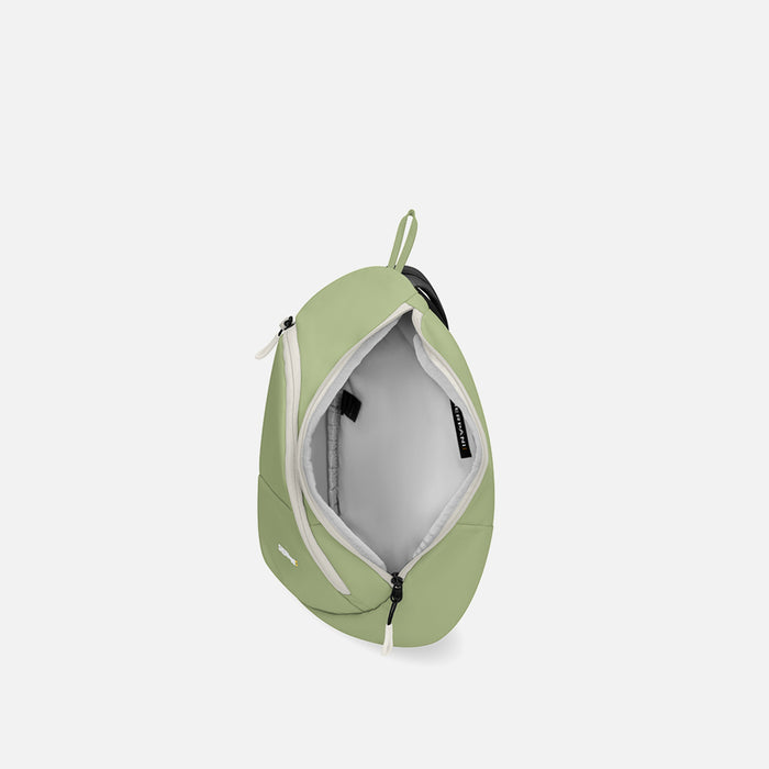 A Sherpani Wayfarer Palm Green Convertible Sling, above view showing inside of main pocket against white background.  #color_palm-green