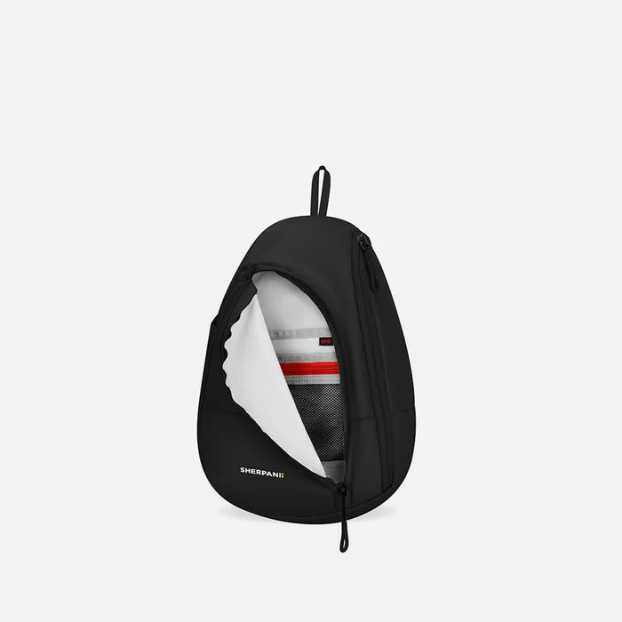 A Sherpani Wayfarer Raven Black Convertible Sling, front view showing inside pocket against white background.   #color_raven-black