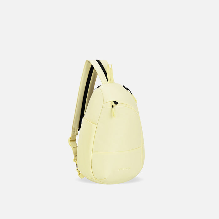 A Sherpani Wayfarer Sol Yellow Convertible Sling, 3/4 view showing lockable pockets and main strap on white background. #color_sol-yellow