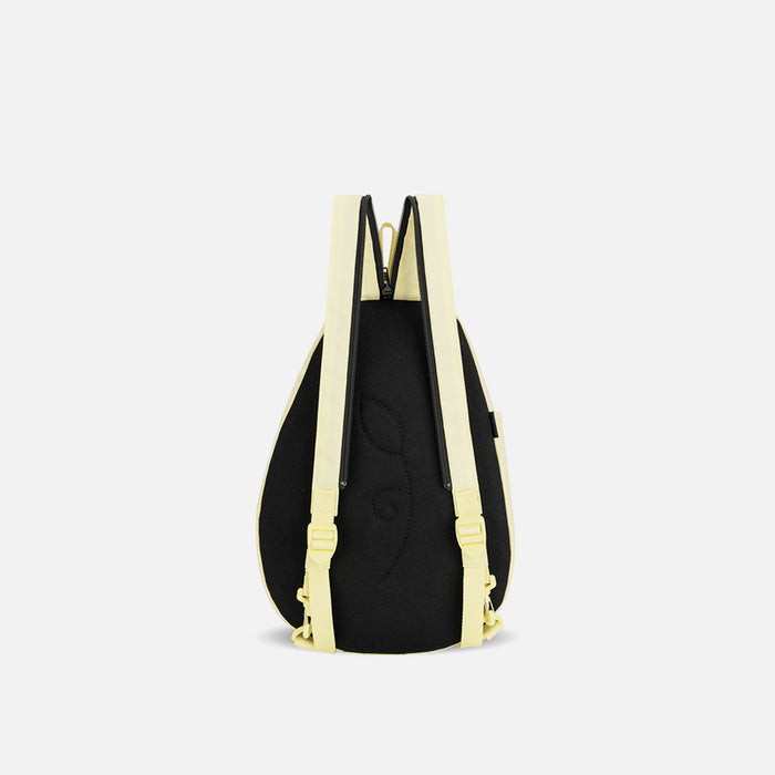 A Sherpani Wayfarer Sol Yellow Convertible Sling, back view showing convertible strap against a white background. #color_sol-yellow