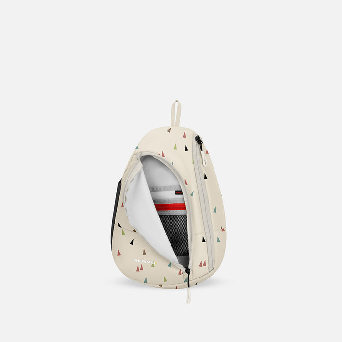 A Sherpani Wayfarer Terrazzo Print Convertible Sling, front view showing inside pocket against white background.  #color_terrazzo-print