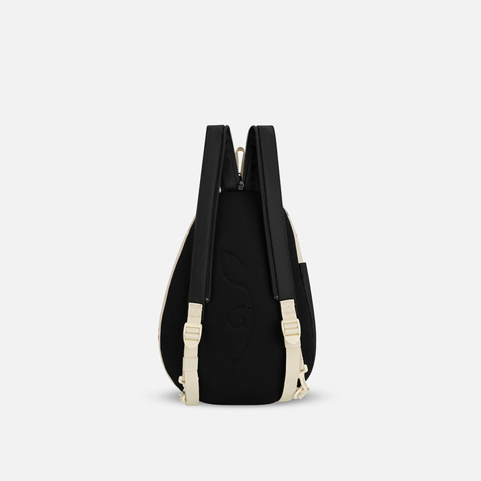 A Sherpani Wayfarer Terrazzo Print Convertible Sling, back view showing convertible strap against a white background. #color_terrazzo-print