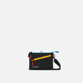 Black Sherpani crossbody bag with colorful zipper on a white background #color_chromatic-black