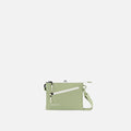 A Sherpani Zoom Palm Green Slim RFID Crossbody, front view showing strap and pockets on white background.  #color_palm-green