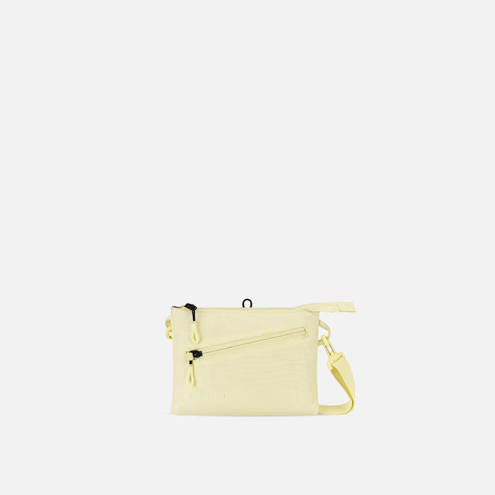 A Sherpani Zoom Sol Yellow Slim RFID Crossbody, front view showing strap and pockets on white background.  #color_sol-yellow