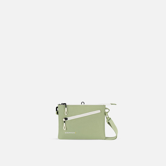 A Sherpani Zoom Palm Green Slim RFID Crossbody, front view showing strap and pockets on white background.  #color_palm-green
