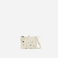 A Sherpani Zoom Terrazzo Print Slim RFID Crossbody, front view showing strap and pockets on white background. #color_terrazzo-print