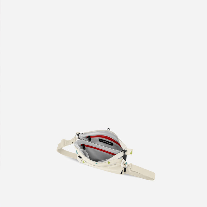 A Sherpani Zoom Terrazzo Print Slim RFID Crossbody, above view showing inside the two main pockets against white background. #color_terrazzo-print